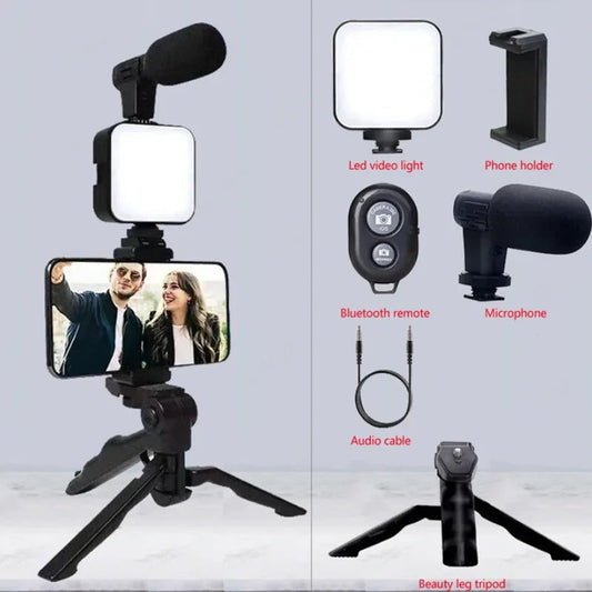 Set of video recording equipment including a phone holder, LED video light, microphone, Bluetooth remote, audio cable, and beauty leg tripod on a gray background.