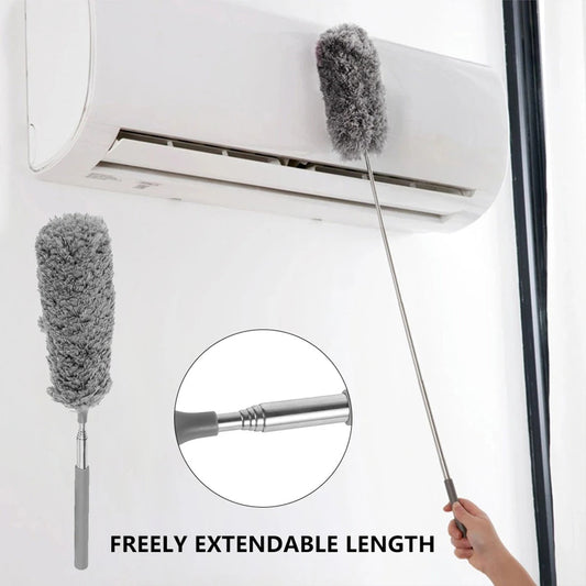 Cleaning tool with extendable handle cleaning an air conditioner, showing freeness of movement.