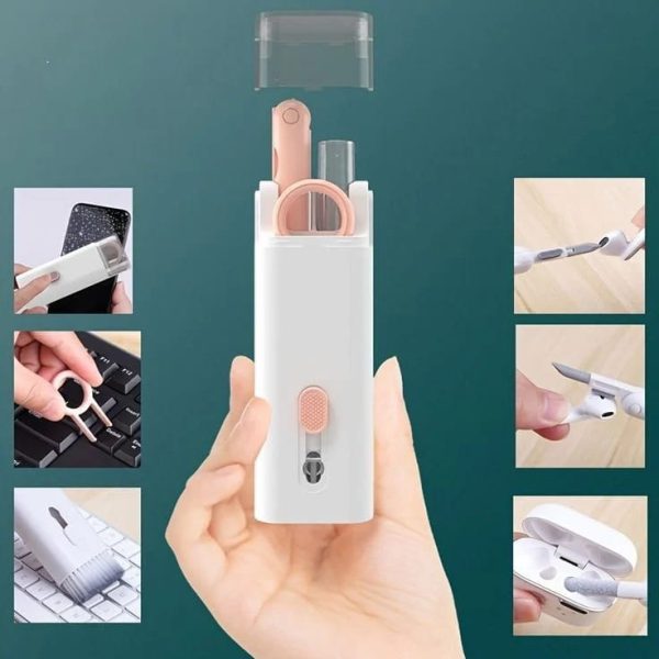 Portable nail care set with scissors and clippers held in a hand against a teal background.