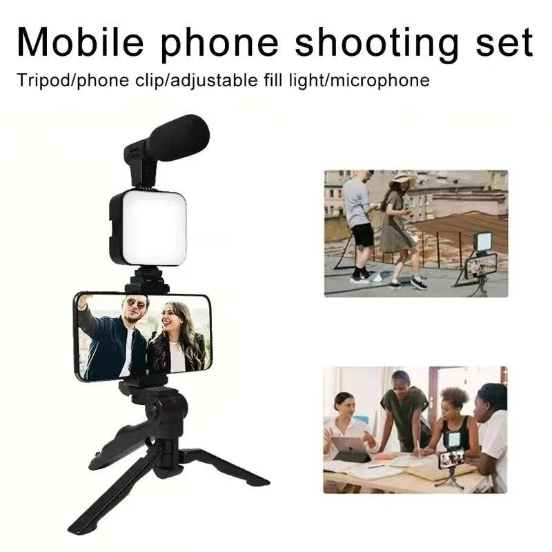 Mobile phone shooting set with tripod, phone clip, adjustable fill light, and microphone on a white background.