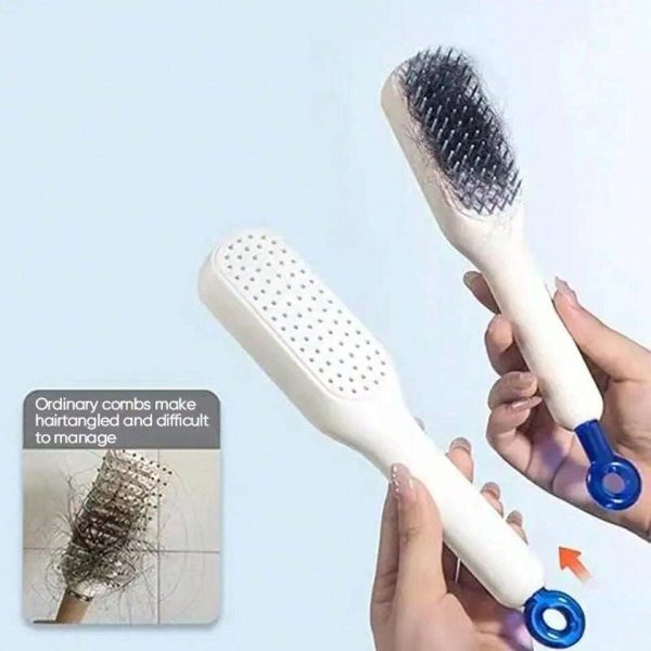 Hairbrush with bristle head and scrubber surface, held by a hand against a light blue background.